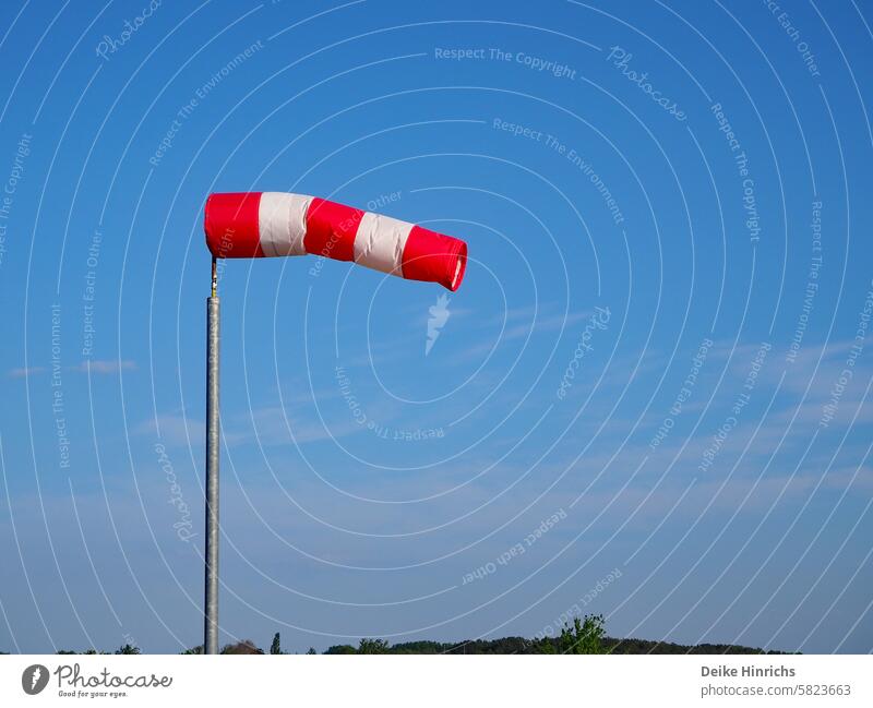 A stiff breeze: a red and white striped windsock flutters against a bright blue sky. Summer Summer vacation Wind windy Ocean Sky North Sea Baltic Sea holidays