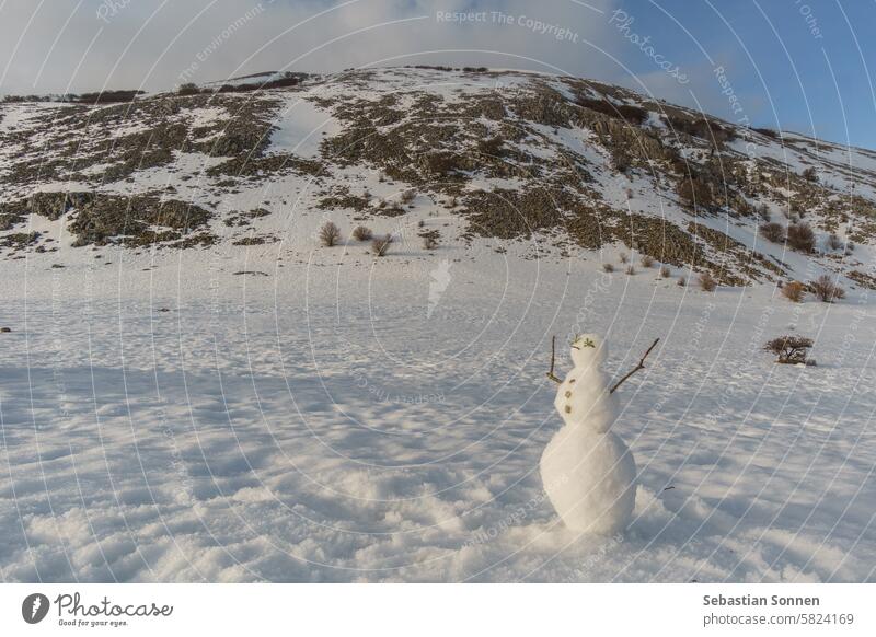 Snowman in front of mountain landscape of Madonie Natural Park in winter covered in snow on a sunny day, Sicily, Italy snowman travel madonie sicily sky tourism