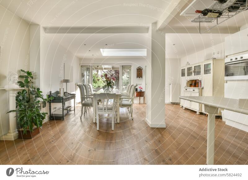 Bright and spacious living room with modern kitchen in Amsterdam amsterdam schaarweg hardwood floor dining area natural light white furniture interior design