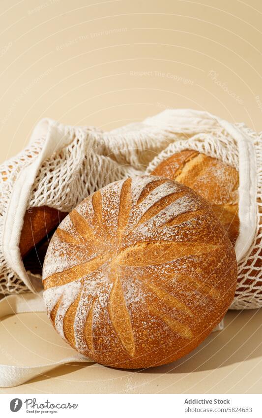 Fresh Sourdough Breads in Rustic Cloth Bag sourdough bread artisanal rustic cloth bag golden crust bakery homemade natural fermented wheat loaf nutritious