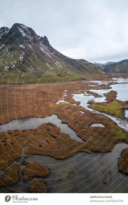 Serene aerial highlands landscape with mountain and stream nature scenic tranquil remote peak meandering view serene outdoor wilderness majestic beauty water