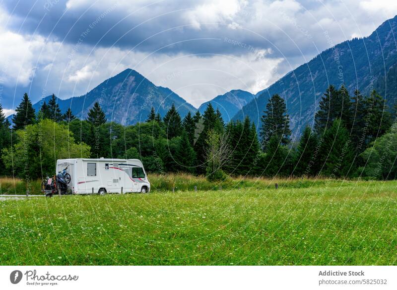 Motorhome camping in the scenic Italian and Austrian Alps motorhome italian alps austrian alps outdoors adventure tranquility travel nature green field