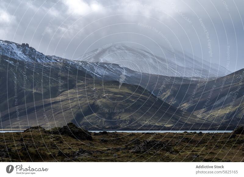 Majestic snow-covered peak in Iceland's Highlands iceland highlands mountain serenity landscape rugged terrain remote nature wilderness icelandic volcanic rock