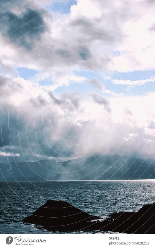 Dreamy atmosphere with light and shadow on the Scottish fjord Dreamily Scotland water landscape seaboard Flare seascape Clouds romantic Scottish nature silent