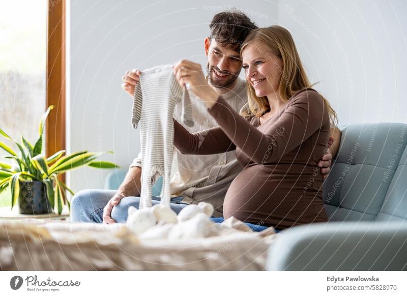 Portrait of a loving couple expecting a baby pregnancy pregnant adult anticipation awaiting belly birth body care caucasian child expectant expectation family