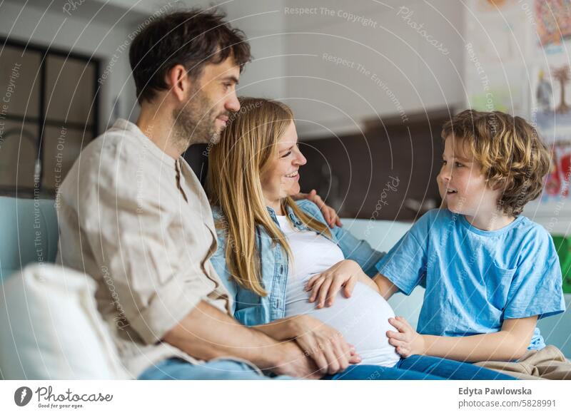 Young family waiting for the new baby pregnancy pregnant adult anticipation awaiting belly birth body care child expectant expecting expectation health