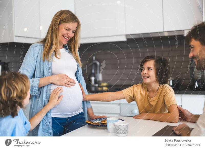 Young family waiting for the new baby pregnancy pregnant adult anticipation awaiting belly birth body care child expectant expecting expectation health