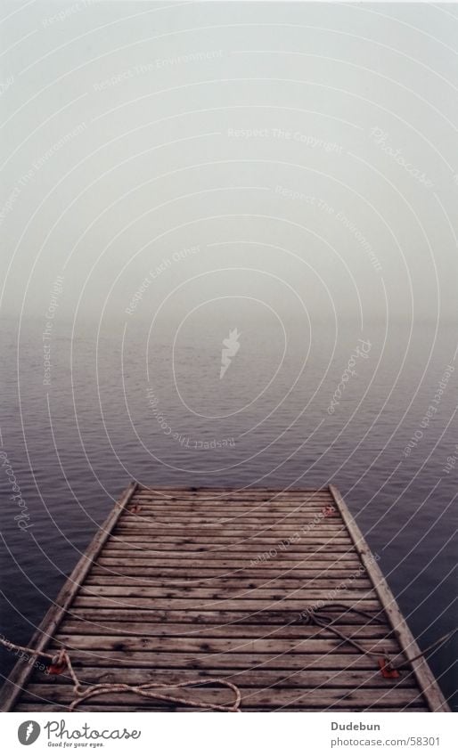 Boat Dock Colour photo Subdued colour Exterior shot Deserted Dawn Deep depth of field Ocean Rope Nature Water Autumn Weather Fog Lakeside Wood Loneliness