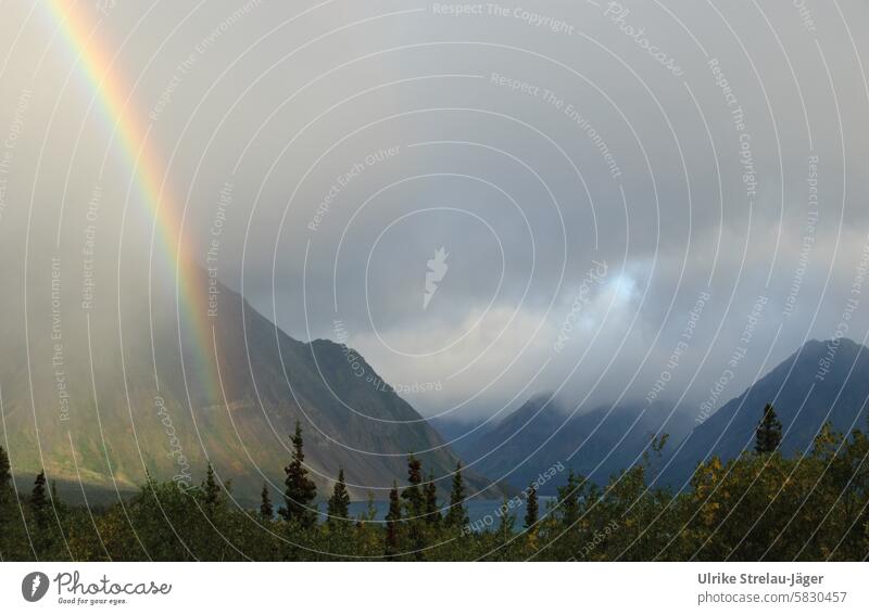 Alaska | Rainbow waterfall in the mountains mountain lake Sun Raincloud Clouds Gray clouds Mountain Sky Landscape Nature Vacation & Travel Lake Freedom