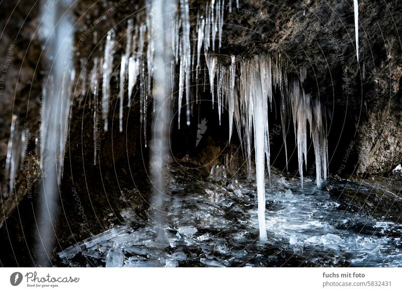 Icicle in a cave Ice Winter Cold Snow Frozen Blue Frost Water Sky White chill Deserted Roof Weather Climate Winter mood House (Residential Structure) Freeze