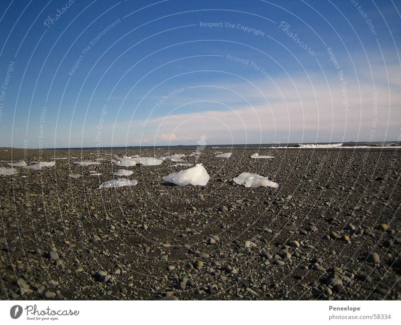 Ice on the beach White Beach Clouds Iceberg Far-off places Ocean Winter Beautiful sclack Blue Sky Crystal structure more Stone Weather