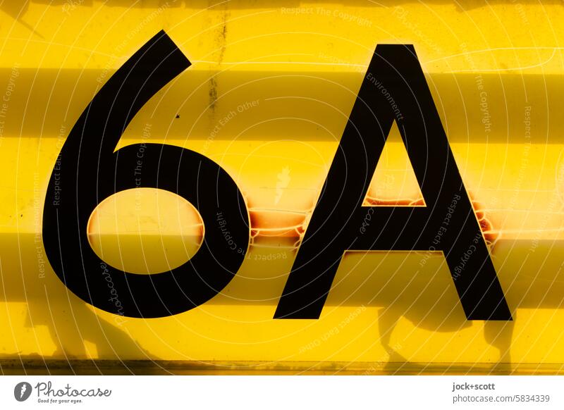 6 A lights up six a Lightbox Digits and numbers Signs and labeling Clue Traffic infrastructure Warmth Symbols and metaphors Illuminate Typography Retro