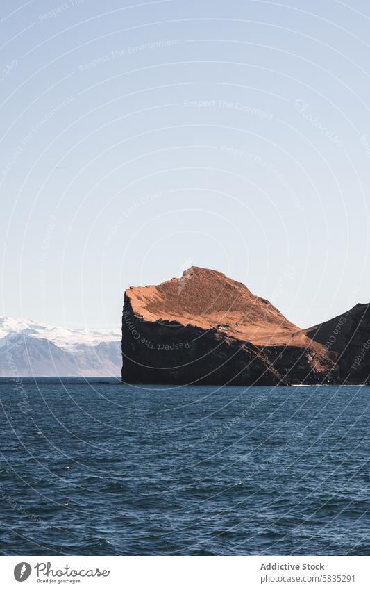 Rugged cliffs of Westman Islands under blue skies westman islands snaefellsnes peninsula iceland ocean rock formation sea blue sky natural scenic outdoors