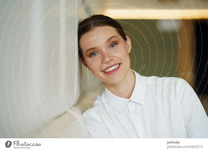 Beauty young woman in elegant clothes leaning on a cafeteria portrait beauty posing smile radiant chic stylish confident graceful modern fashionable model