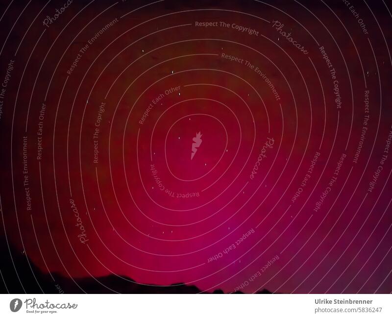 Northern lights in the Austrian Alps with a large car aurora polaris Aurora Borealis aurora borealis luminous phenomenon solar wind Solar activity sunstorm Sky