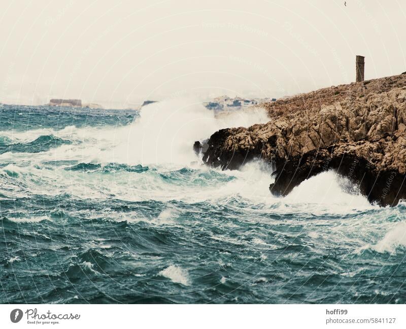 Wild waves wash around a rocky headland Wild Water Waves Splashing Rock Rocky coastline Ocean Exterior shot Bay Stone Vacation & Travel Summer Beach Sky