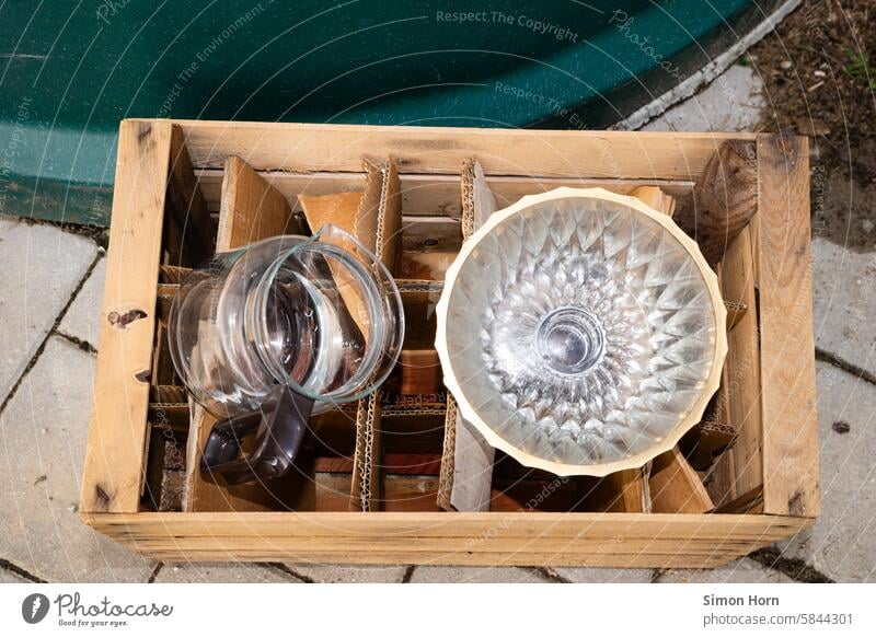 Wooden box with glass containers to give away Roadside Bulk rubbish Glass container Coffee pot Glass bowl household contents Second-hand Old Crate Reflection