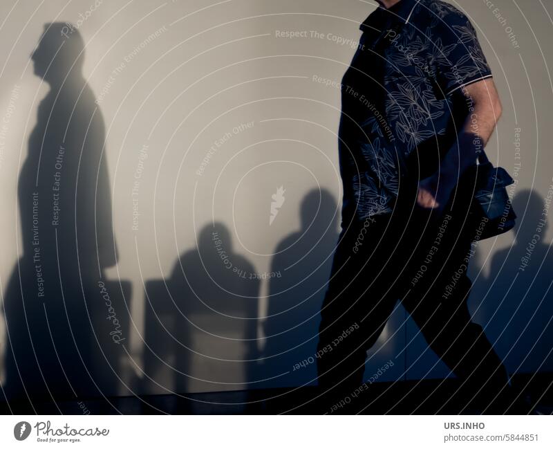 Shadows of people sitting in a waiting room, the light projects the shadow of a person walking past onto the wall Light persons sedentary Concourse Room Wait