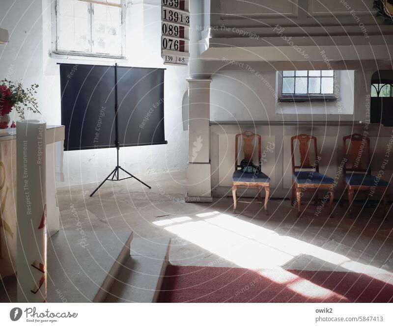 Evangelical Lutheran Church. sanctuary Canvas Sunlight Shaft of light choir room chairs Old Village church flooded with light Church window interior piers Altar