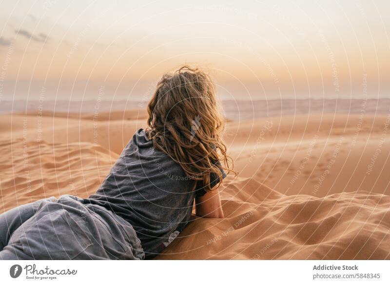 Serenity woman in the sands Oman desert at sunset dune relax trip nature tranquility solitude travel adventure scenic landscape anonymous outdoors tourist