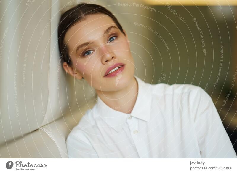 Beauty businesswoman leaning the head on a cafeteria portrait beauty young contemplative professional relaxed pensive thoughtful serene poised elegant