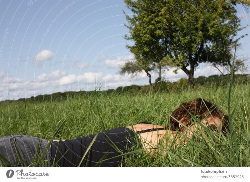 Woman lying in a meadow Meadow Summer feeling Sleep Siesta Lie Break Fatigue Goof off Relaxation Dream To enjoy Rest Serene relax chill rest Nature tranquillity