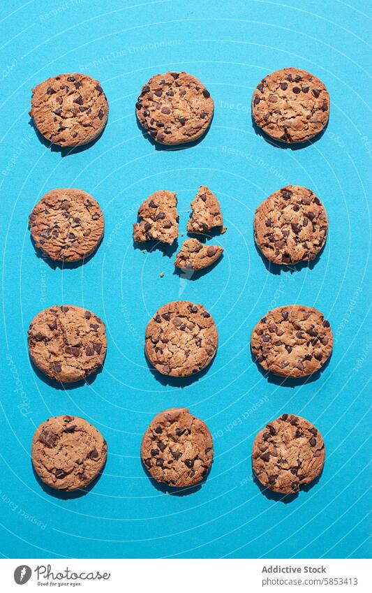 Delicious Homemade chocolate chip Cookies – Flat Lay American Cookies Arrangement Baked Dessert Baked Sweets Blue Surface Broken Cookies CHOCOLATE COOKIES