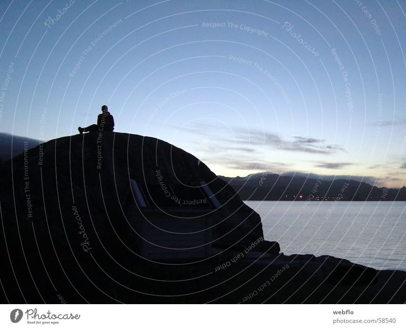 On the stone Clouds Ocean Black Extensive Stone Rock Shadow Sky Water Silhouette Blue Human being Nature