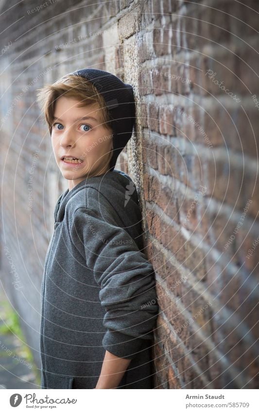 Portrait of a teenager pressed against a wall with a frightened expression Fear Youth (Young adults) Lifestyle Human being Masculine 1 8 - 13 years Child