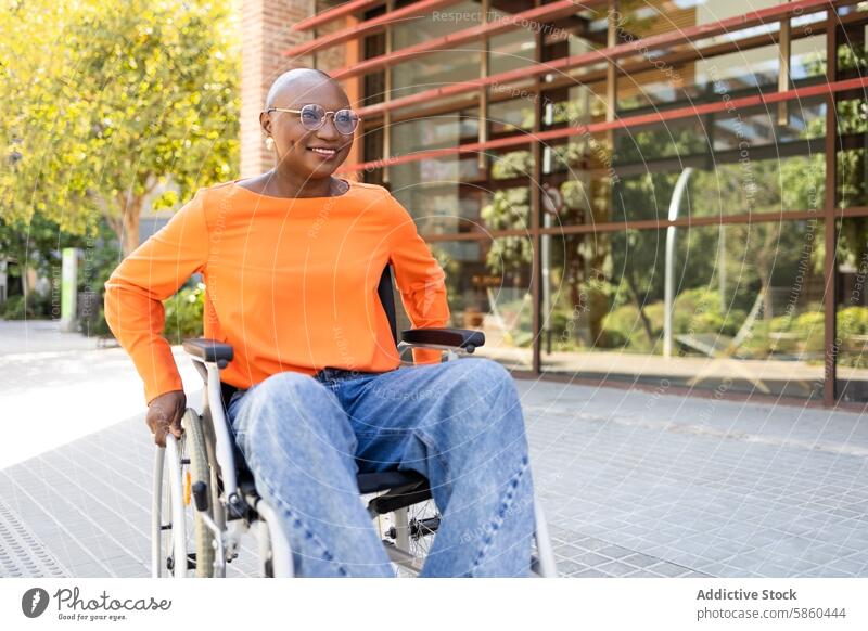 Confident black woman in wheelchair at modern office exterior business ethnic african american confidence positivity smiling accessibility inclusive