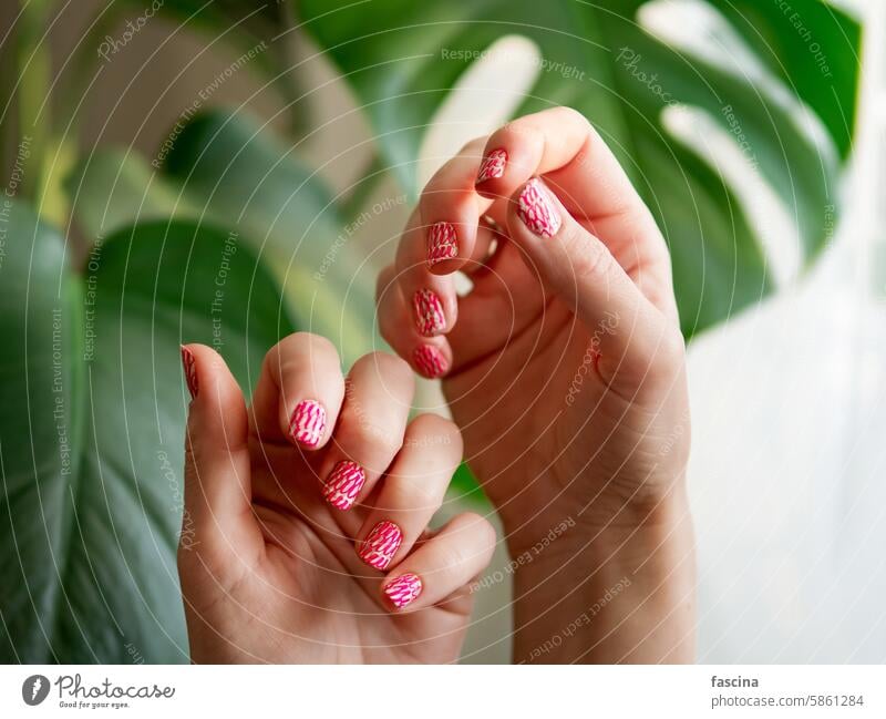 Hands with pink neon stamping nails manicure beauty fashion vibrant short female aesthetic style trend design art colorful bold bright trendy background woman