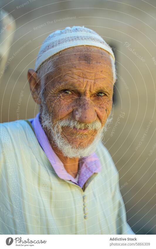 Elderly Moroccan man with expressive eyes elderly moroccan portrait traditional face north africa culture ethnicity aged senior wisdom male lines wrinkles