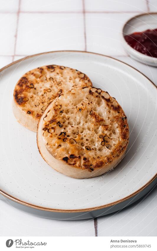 British popular breakfast - toasted crumpets jam hot table scone tasty food snack english traditional spongy british butter delicious pikelets griddle bread