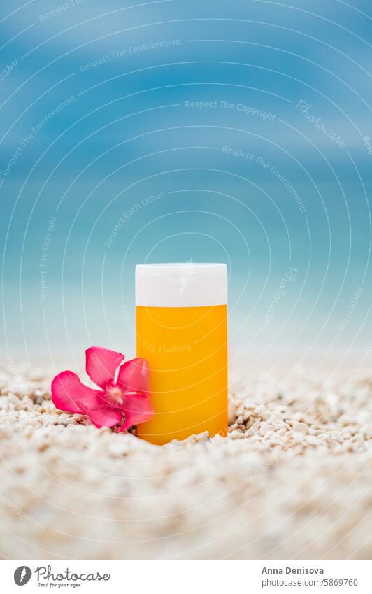 Sunscreen bottle on the beach sunscreen summer product pebbles sand skin sunblock landscape template mockup layout mock up sea ocean water healthy advertising