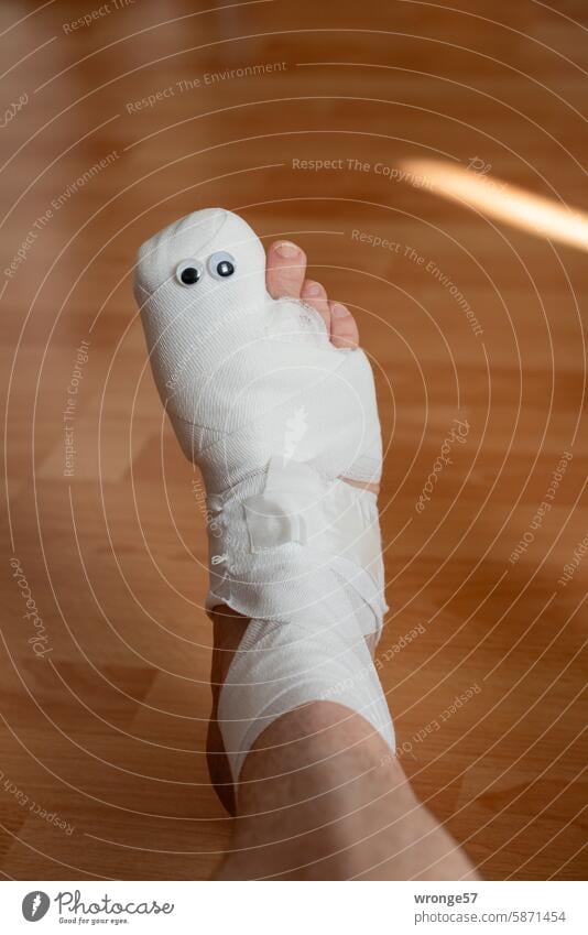 Bandaged right foot with 2 googly eyes bandaged Operation immobilisation Pain Healthy Wound Colour photo Medical treatment Healing Boredom saucer-eyed