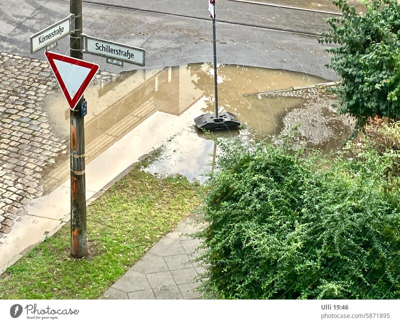 Water jam.............. Street corner cross Flood Deluge Edge of the road Sidewalk amount of water Wet Climate Weather Bad weather inundation Inundated