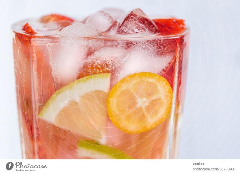 Refreshing cool water with flavor: lemon, kumquat, strawberries and ice cubes for a hot summer day Beverage Refreshment drink Cold drink Lemonade Fresh Ice cube