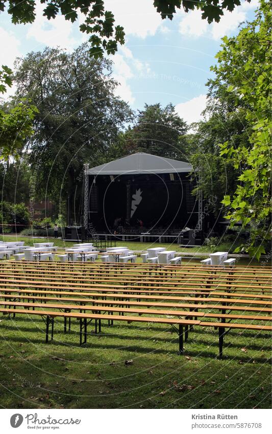 preparation for the concert in the park Outdoor festival Concert Stage tables benches Classical concert Firm Event event out Park trees Nature Summer Culture