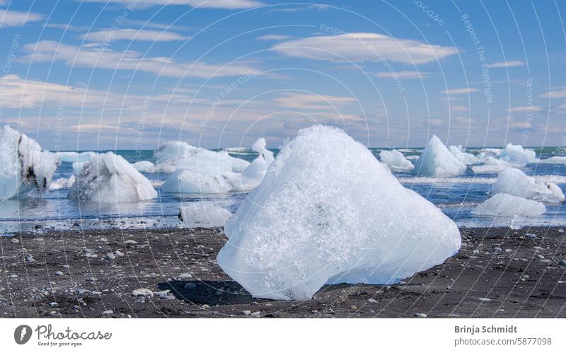 Chunks of ice washed up on lava sand in Diamond Bay at Jökulsárlón, Iceland amazing national park Vatnajökull beauty scenic Frost polar light coast Jökulsárlon