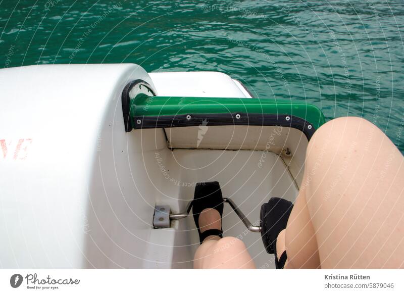 paddle Pedalo Pedals Driving Tread Legs feet bread rolls go boating Lake Body of water Water vacation free time Relaxation fun Athletic active Summer Green