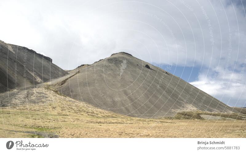 Typical, barren landscape in southwest Iceland with bare mountains in solitude extremes loneliness cold rural unlimited glacial savage atmospheric vegetation