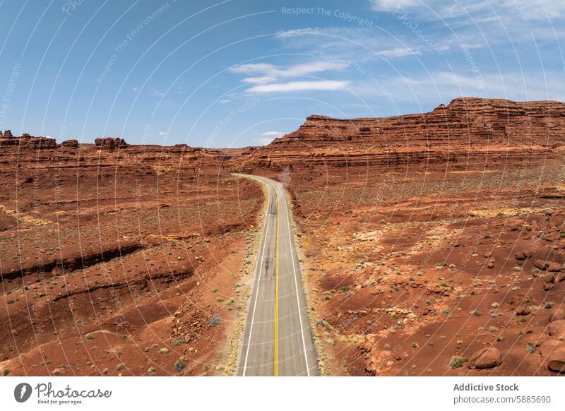 Scenic road trip through Valley of the Gods, Utah valley god utah usa landscape travel sky blue rugged sandy rock formation striated clear scenic desert nature