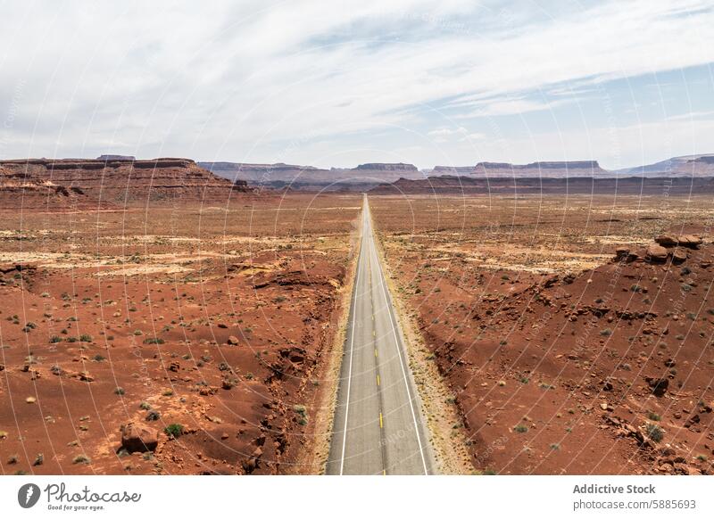 Vanishing road through Valley of the Gods, Utah valley utah usa landscape desert sky cloud horizon nature travel scenic outdoor barren dusty rugged tourism