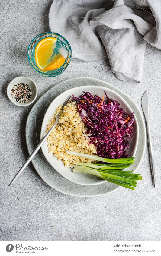 Healthy lunch set with cabbage salad and bulgur on plate healthy carrot dietary raw red cabbage boiled green onion citrus water meal light nutritious fiber