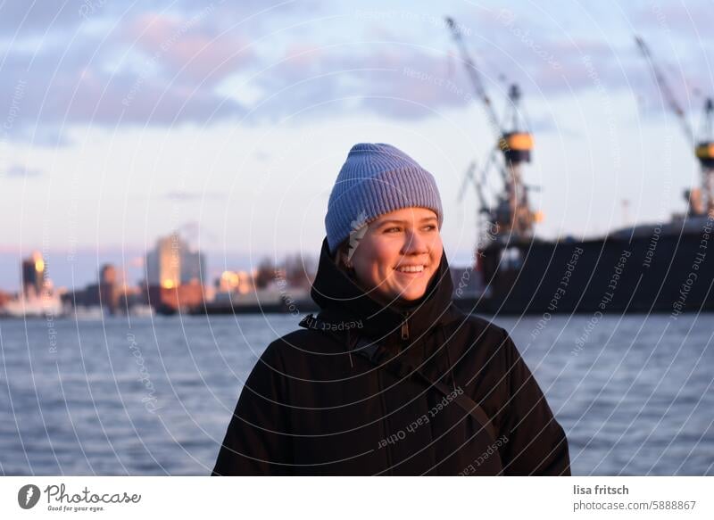 LAUGHING WOMAN - EVENING SUN - HAMBURG Woman Winter Cap winter jacket Cold Hamburg Elbe Sightseeing Elbe Philharmonic Hall Harbour Port City Tourist Attraction