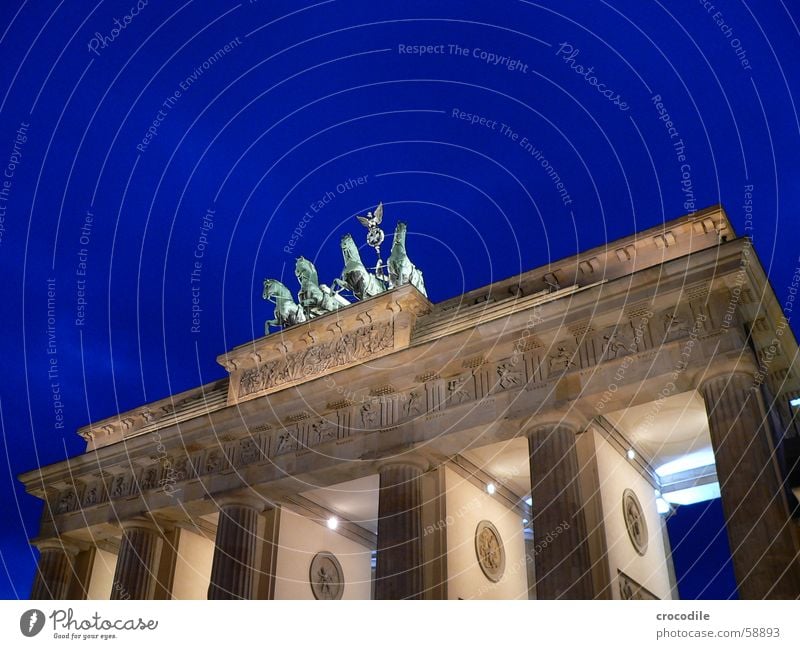 Brandenburg Gate Lamp Lighting Green Yellow Landmark Symbols and metaphors Monument Traffic infrastructure Might Berlin Rider Blue Sky Stone