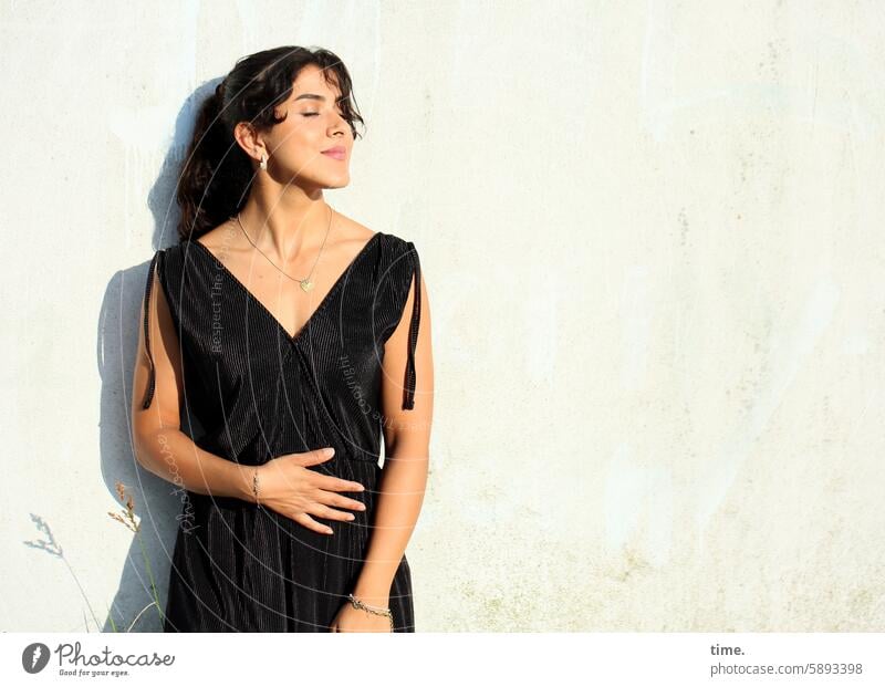 Woman in the setting sun portrait Long-haired Feminine Jewellery Half-profile Concentrate Pantsuit Braids Stand To enjoy sunny Evening sun Shadow devotion Hand