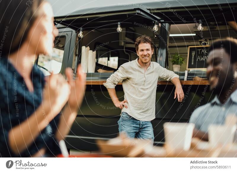 Multiracial friends having fun eating at food truck outdoor - Focus on center man face african away bar beverage black cafeteria coffee counter customer