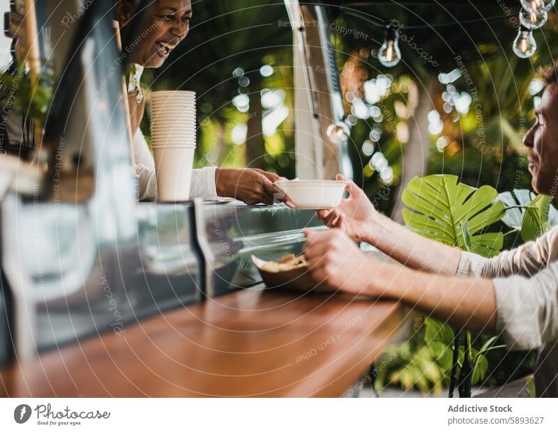 Senior african woman serving food to customer inside food truck - Focus on hands holding food plate away bar beverage business buying cafeteria chef city client