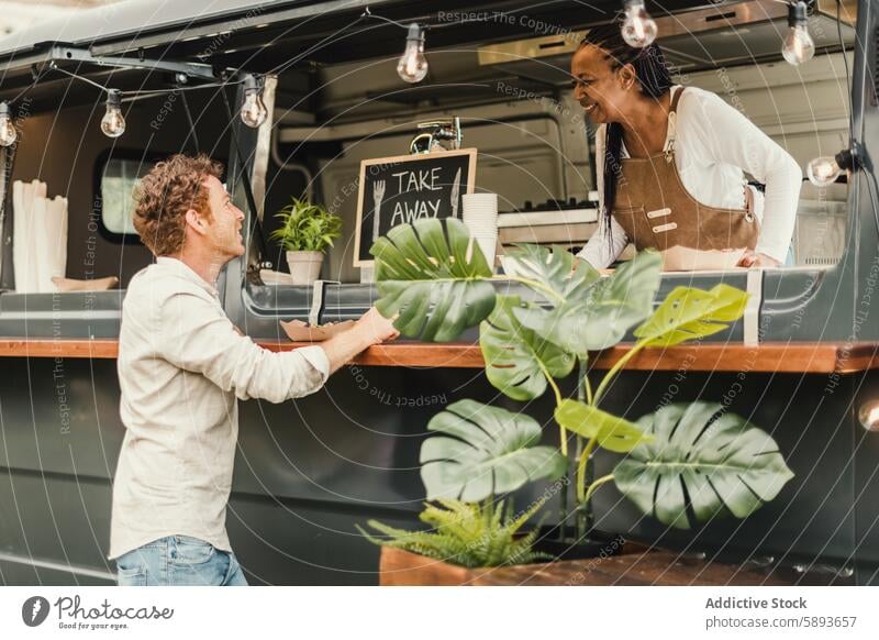 African chef woman taking order from customer at food truck outdoor - Focus on man face african away bar beverage business cooking counter delivery dinner eat